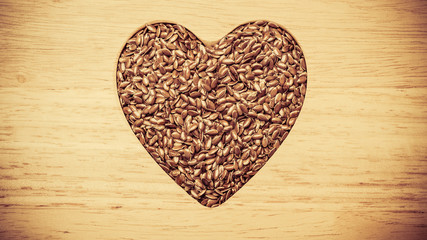 Raw flax seeds linseed heart shaped