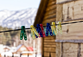 plastic clothes pins on a rope, nature background