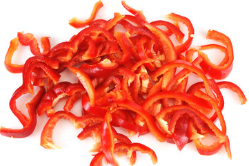 fresh chopped red pepper for salad isolated on white background