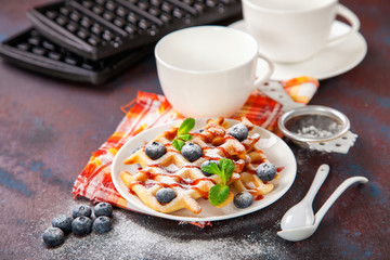 Homemade wafers with berries and tea on a table. Selective focus. Copy space.