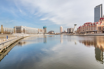 Naklejka premium River And Modern Buildings Against Sky in Tianjin,China.