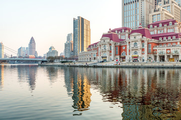 Obraz premium River And Modern Buildings Against Sky in Tianjin,China.