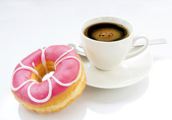 Donut and cup of coffee on white background
