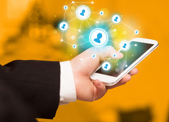 Finger pointing on smartphone, social network concept