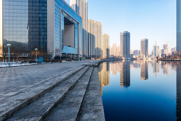 Obraz premium River And Modern Buildings Against Sky in Tianjin,China.