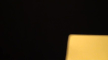 Football referee showing a yellow card to a player on black background. Cards penalty, punishment. Adrian