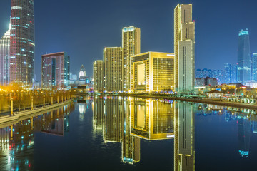Obraz na płótnie Canvas River And Modern Buildings Against Sky in Tianjin,China.