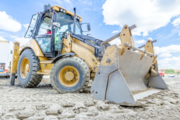 Low view on excavator's front bucket
