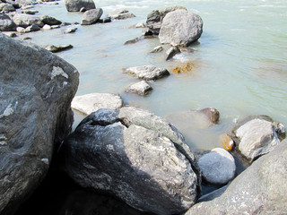 Flowing river with rocks and stones