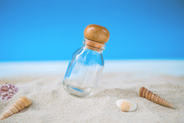 bottle over tropical sand beach with clear blue sky, background for love travel on vacation summer concept.