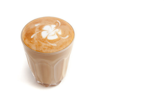 Piccolo Latte art in small glass on white background isolated