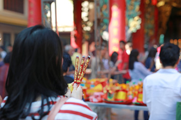 People pray respect with Incense burning for god in Chinese New Year day at chinese temple in...