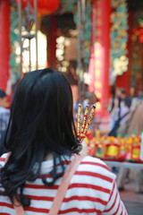 People pray respect with Incense burning for god in Chinese New Year day. Which is the cultural beliefs of the Chinese people at chinese temple in bangkok, Thailand.