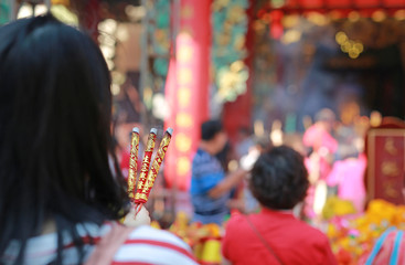 People pray respect with Incense burning for god in Chinese New Year day. Which is the cultural beliefs of the Chinese people at chinese temple in bangkok, Thailand.