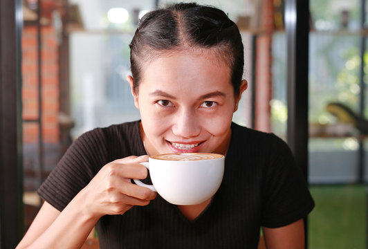 Woman drinking hot coffee in the morning.
