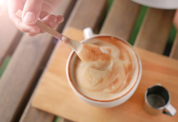 Hot latte coffee coffee on wooden table.