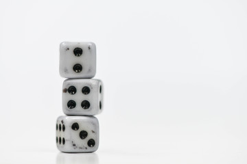 Old three dice stack on the white screen