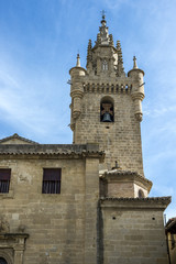 Fototapeta na wymiar Bell tower of the Church of Santa Maria, in Uncastillo, Zaragoza, Spain. It was built between 1135 and 1155 in Romanesque style