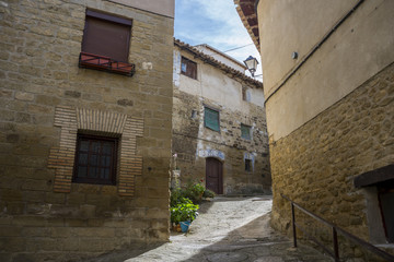 Fototapeta na wymiar Traditional architecture in Uncastillo. It is a historic town and municipality in the province of Zaragoza, Aragon, eastern Spain. In 1966 it was declared a Historic-Artistic site