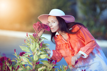  Model wearing stylish accessories & clothes. Girl looking aside. Female beauty & fashion.