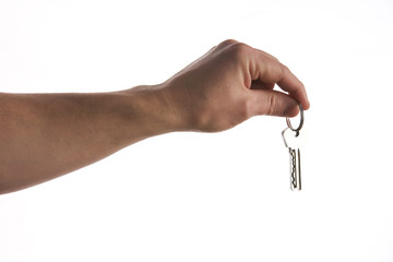 Keys in hand isolated on white