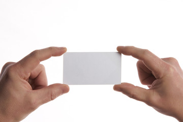 Obraz premium Businessman holding business card with copy space isolated on white background