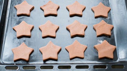Cookies lie on a baking sheet. Cookies in the form of stars.