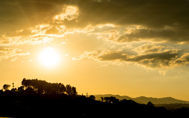 Sunny sky with clouds in the background.
