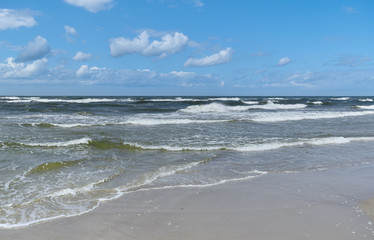 Baltic Sea - water waves. Beautiful blue sky and turbulent sea. 