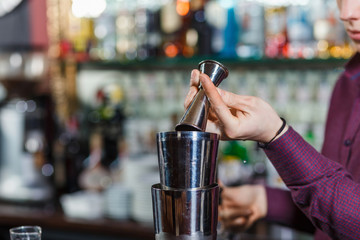 bartender fills a few glasses in a row