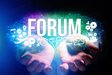 Concept of man holding futuristic interface with forum title and multimedia icons flying all around - Internet concept