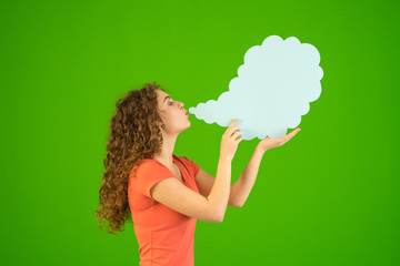 The woman blow a virtual smoke on the green background
