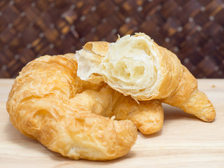 Croissant on cutting board close up