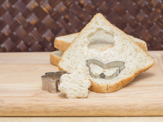 Bread and cute mold on the cutting board