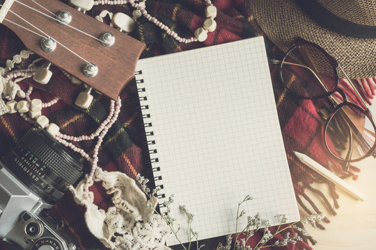 Blank notebook with ukulele and vacation stuff