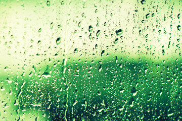 Drops Of Rain On Glass On Green Background. Greenery, Green: Pantone Color - Trend 2017