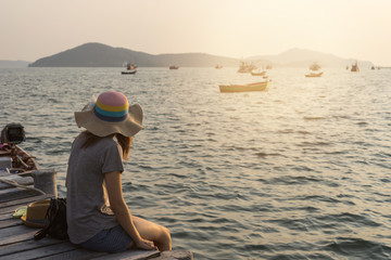 Young women traveller looking at the sea