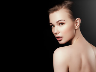 Beauty, spa. Attractive woman with beautiful face. Beautiful girl with daily makeup, youth and skin care concept. Woman beauty face portrait isolated on black with healthy skin. Face with perfect skin