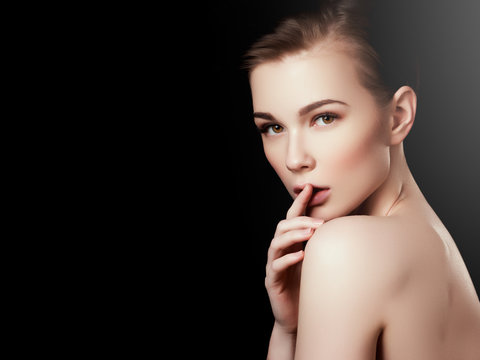 Beauty, spa. Attractive woman with beautiful face. Beautiful girl with daily makeup, youth and skin care concept. Woman beauty face portrait isolated on black with healthy skin. Face with perfect skin
