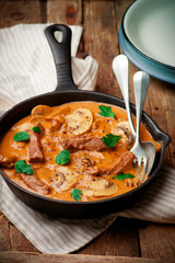 Beef Stroganoff with mushroom in iron pan