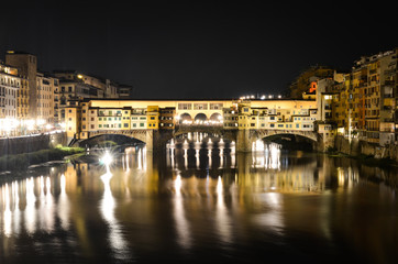 Night bridge Ponte Vecchio over Arno river in Florence