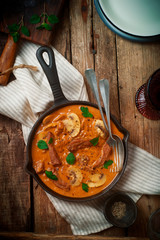 Beef Stroganoff with mushroom in iron pan