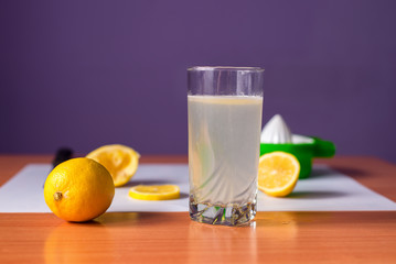 Fresh lemonade on a wooden desk