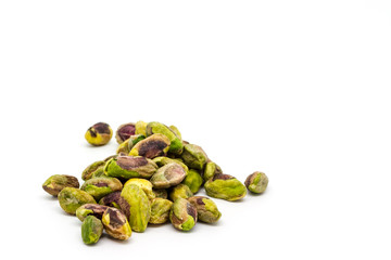 Pistachios against a white background