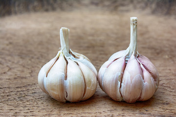 Garlic on wooden vintage background.