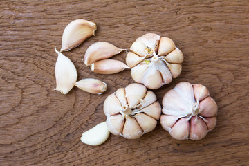 Garlic on wooden vintage background.