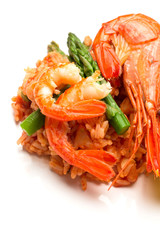 rice with shrimp and asparagus with tomato sauce close up.
