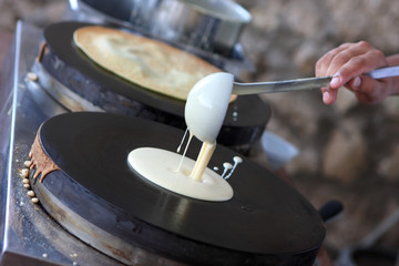 Fototapeta na wymiar Cooking a pancakes