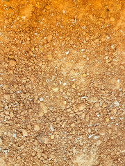 two tone small and large pebble on brick background