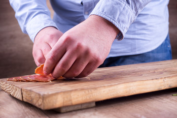 Man is making food arrangement